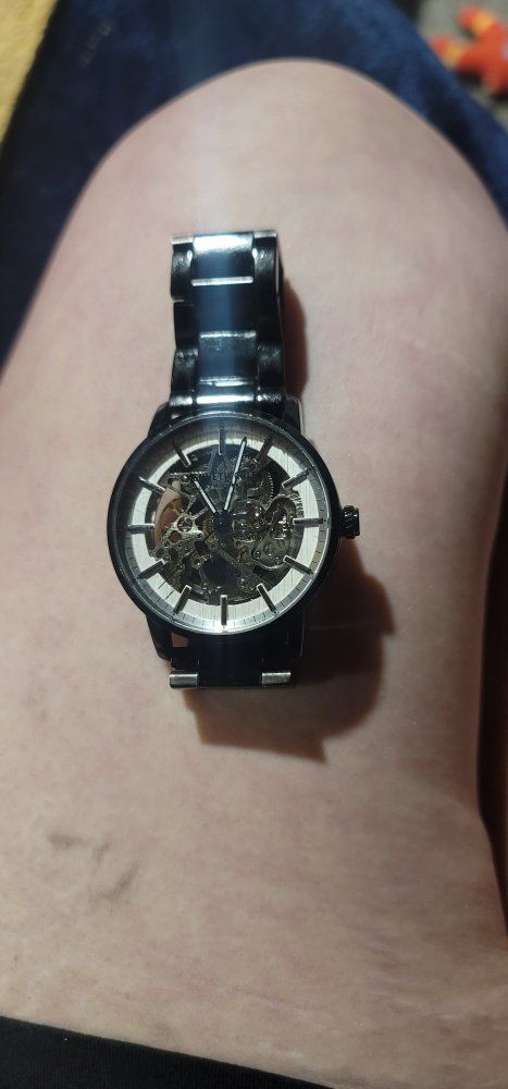kenneth Cole self winding automatic mechanical movement requires no batteries
