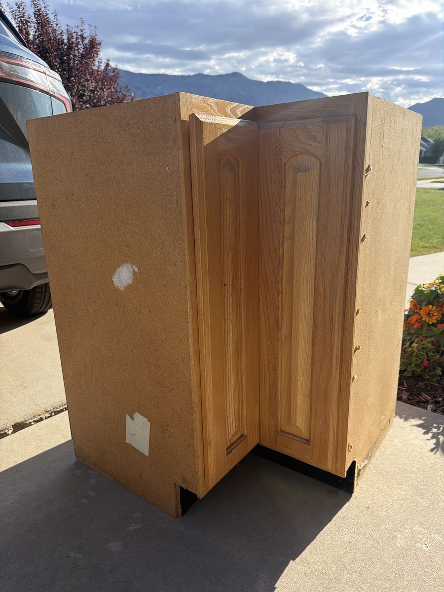 Oak Corner Base Cabinet with Rotating Lazy Susan Shelves. Perfect for a garage.