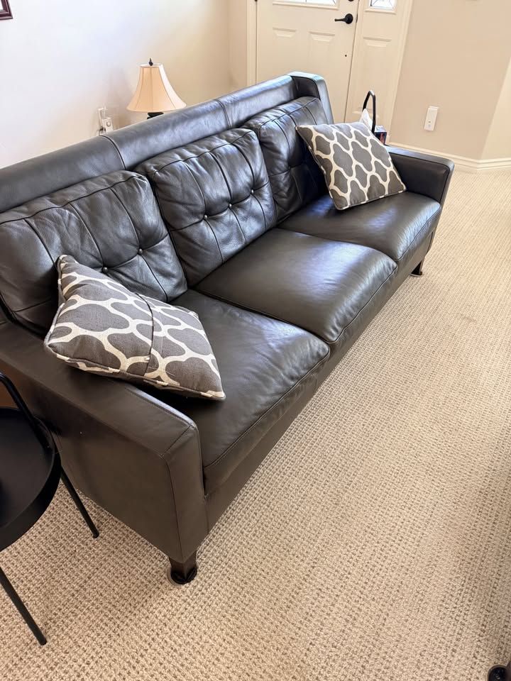 Black couch and ottoman