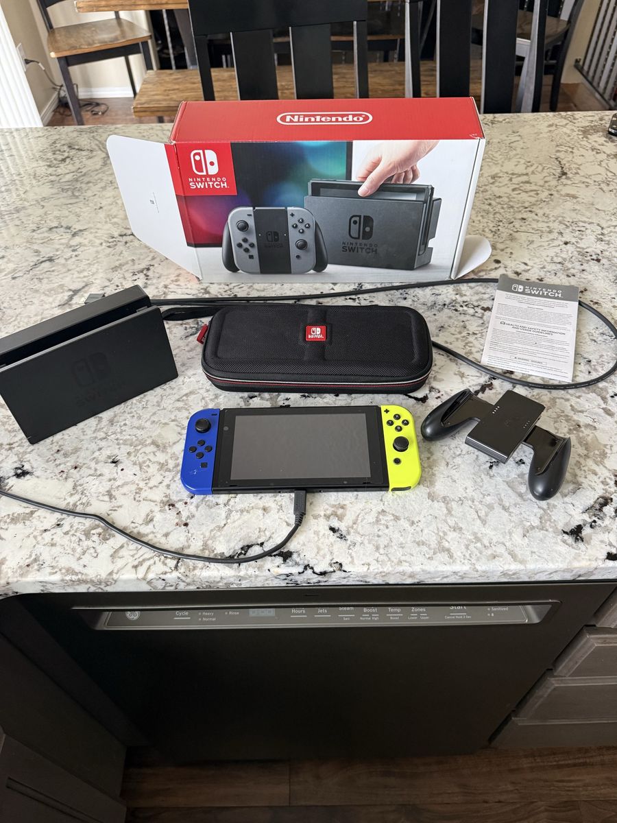 Nintendo Switch Console V1 w/ Neon Joy-Cons, Dock, Charging Grip & Travel Case - Excellent Condition. $125