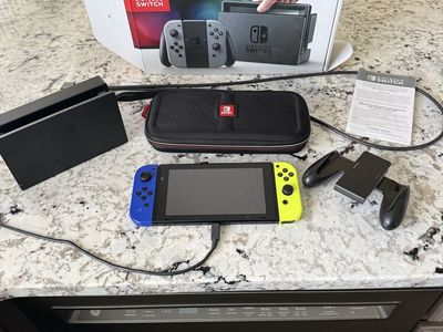 Nintendo Switch Console V1 w/ Neon Joy-Cons, Dock, Charging Grip & Travel Case - Excellent Condition. $125