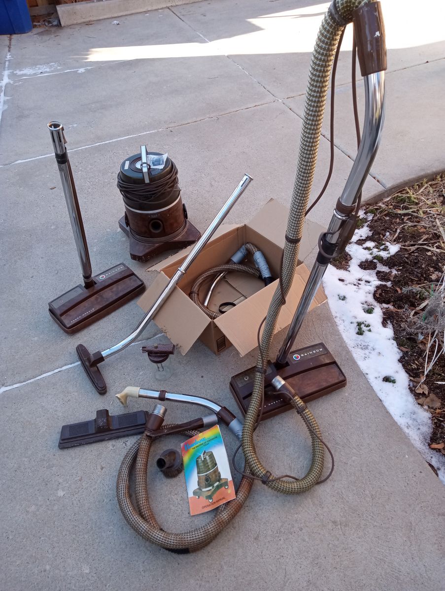 Rainbow vacuum w/extra parts, hoses.