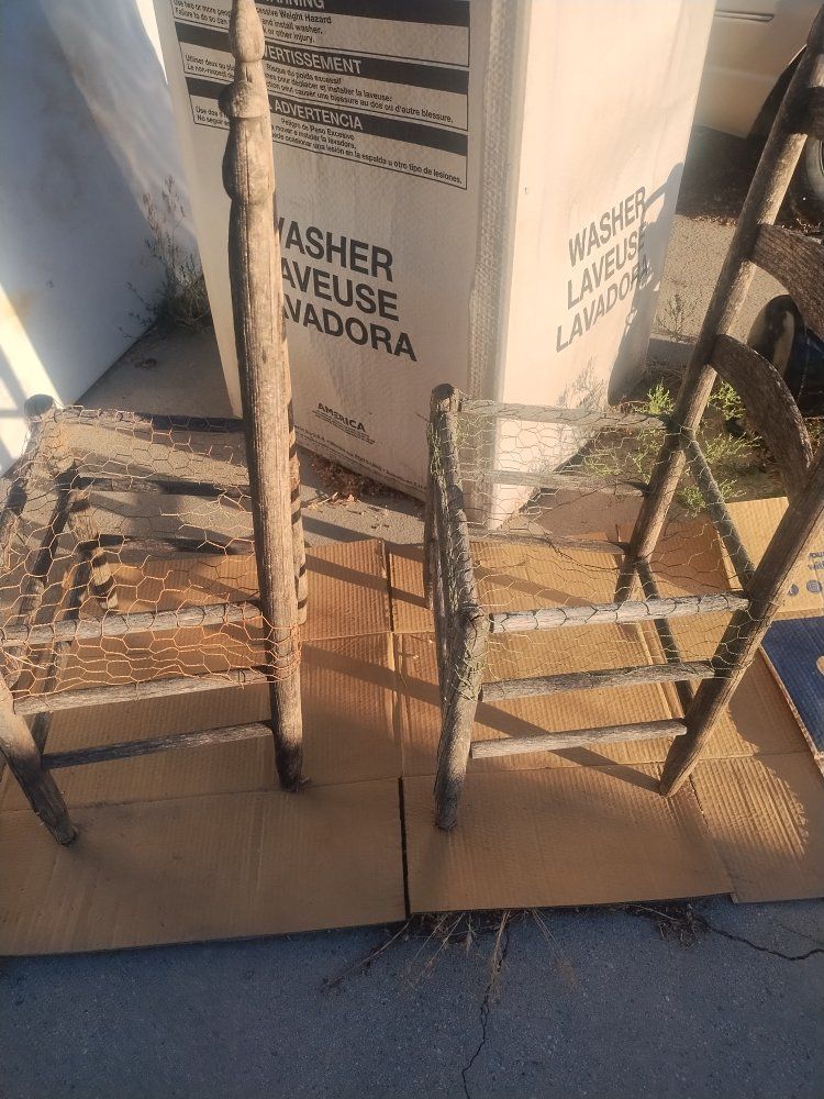 2 wooden chairs for potted plants
