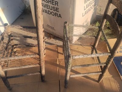 2 wooden chairs for potted plants