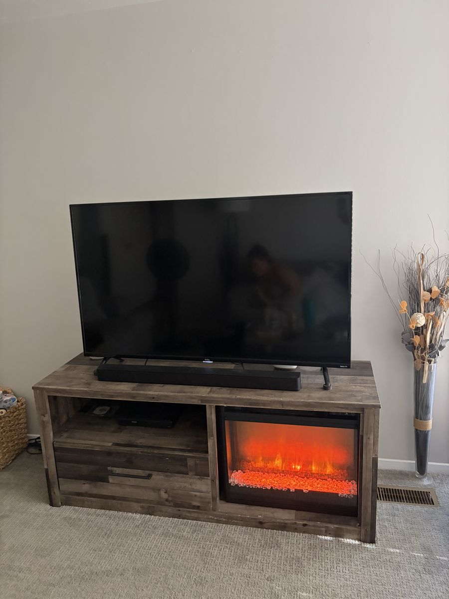 TV stand with artificial fireplace and drawer