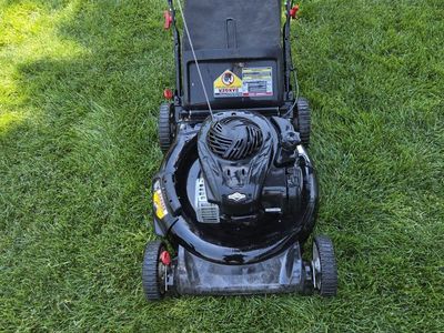 Murry with a Briggs & Stratton Motor Push Lawn Mower with Grass Catcher - Used, Good Condition