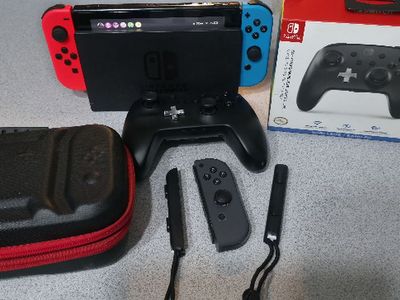 Nintendo Switch w/ NEW Red & Blue Joy-Cons & MORE