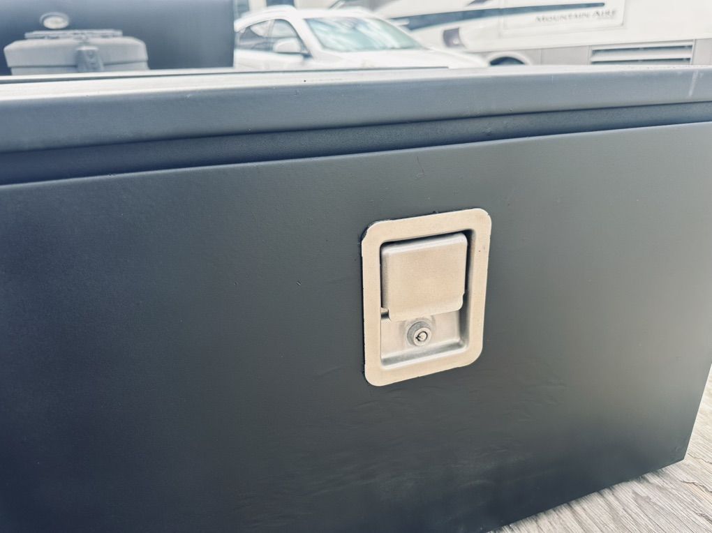 TWO BLACK STEEL UNDERBODY TOOL BOXES