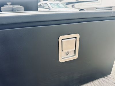 TWO BLACK STEEL UNDERBODY TOOL BOXES