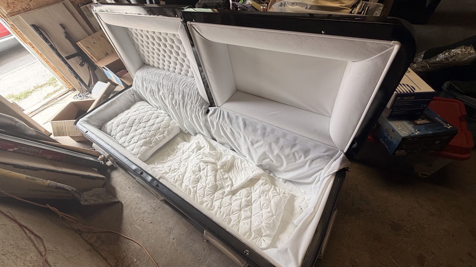 Black Funeral Casket with White Interior & Quilted Accents