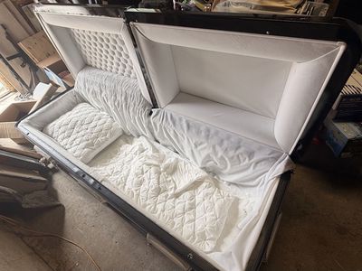 Black Funeral Casket with White Interior & Quilted Accents