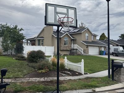 Lifetime Adjustable Basketball Hoop with Shatterproof Backboard
