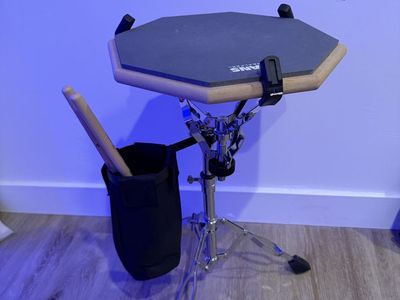 Evans RealFeel - Drummer Practice Pad - 12 inch. Stand and vic firth American Classic 5A drum sticks.