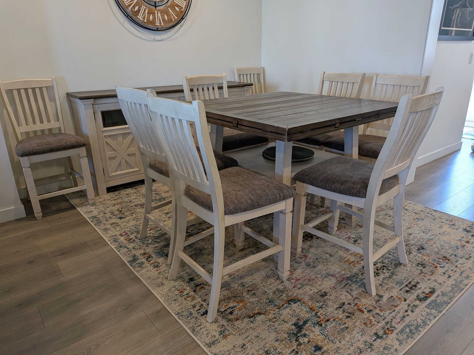 Dining table set with eight chairs and a buffet