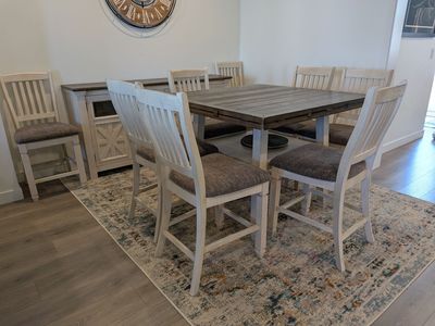 Dining table set with eight chairs and a buffet