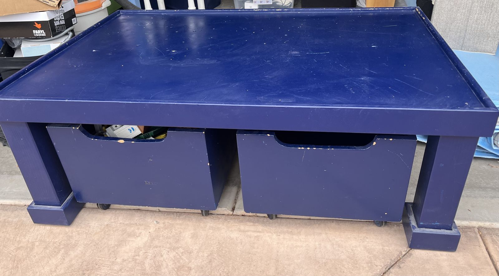 Custom Blue wood table with toy storage bins