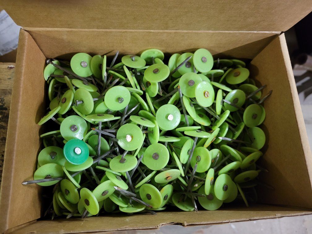 Box of Green Plastic Cap Roofing Nails