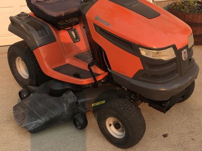 HUSQVARNA RIDING LAWNMOWER WITH THREE BLADE CUTTING DECK