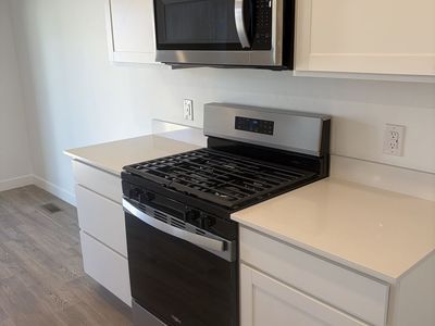 New Whirlpool Gas Range + OTR Microwave