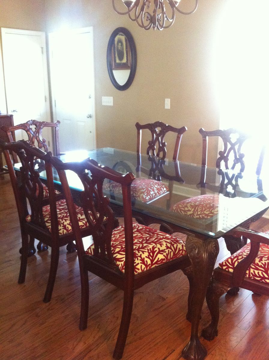 Elegant Wooden Dining Table with Glass Top and Red Coral Patterned Chairs