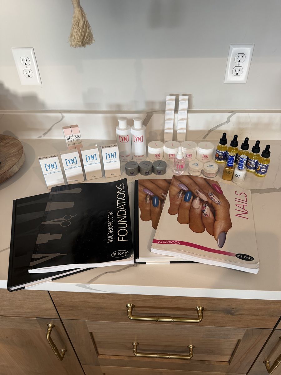 Assortment of nail supplies & books