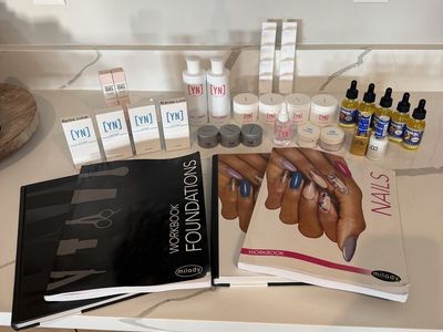 Assortment of nail supplies & books