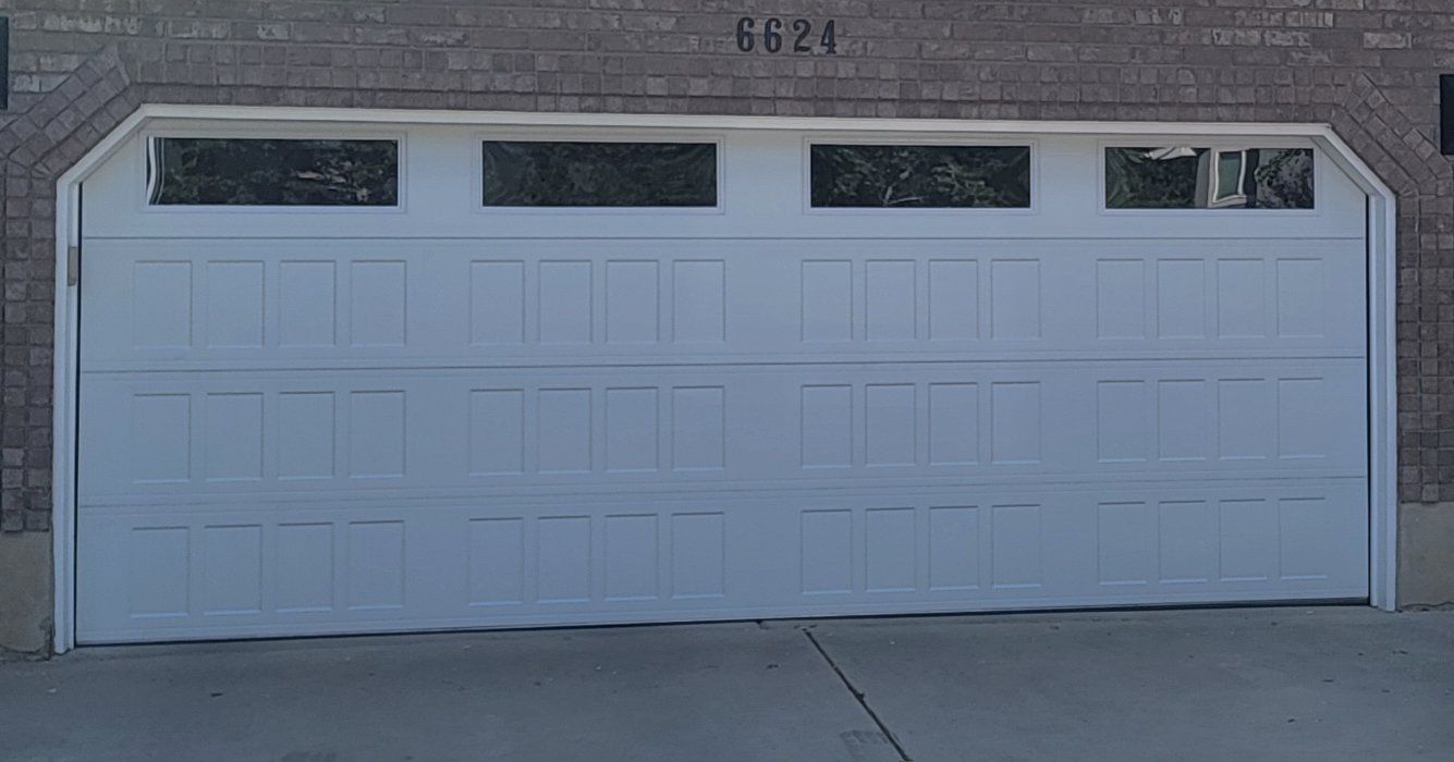 18x7 garage door Insulated, NEW , STEEL BACK WITH WINDOWS