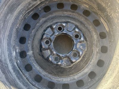 16” steel Ford Crown Victoria wheel.