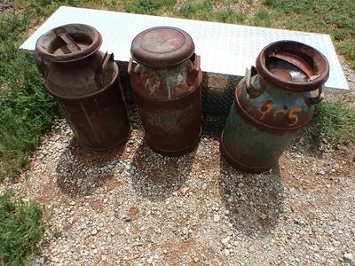 Vintage metal milk jugs