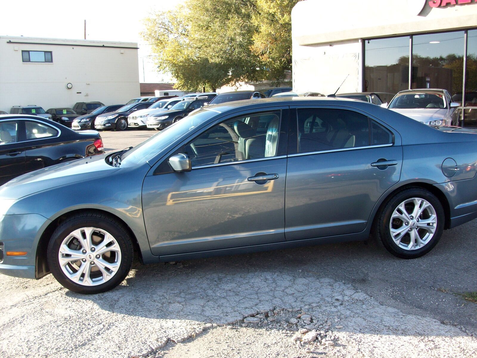 2012 Ford Fusion SE — rebuilt & branded title, 37% below market