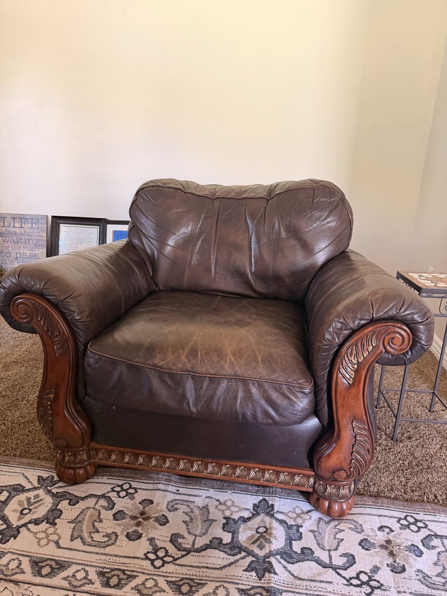 Traditional Brown Leather Armchair with Carved Wood Trim