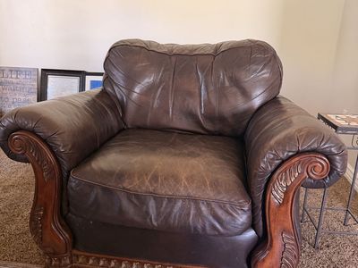 Traditional Brown Leather Armchair with Carved Wood Trim