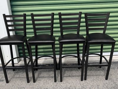 Set of 4 Black Metal Bar Stools with Ladder Backs and Padded Seats - Counter Height Seating