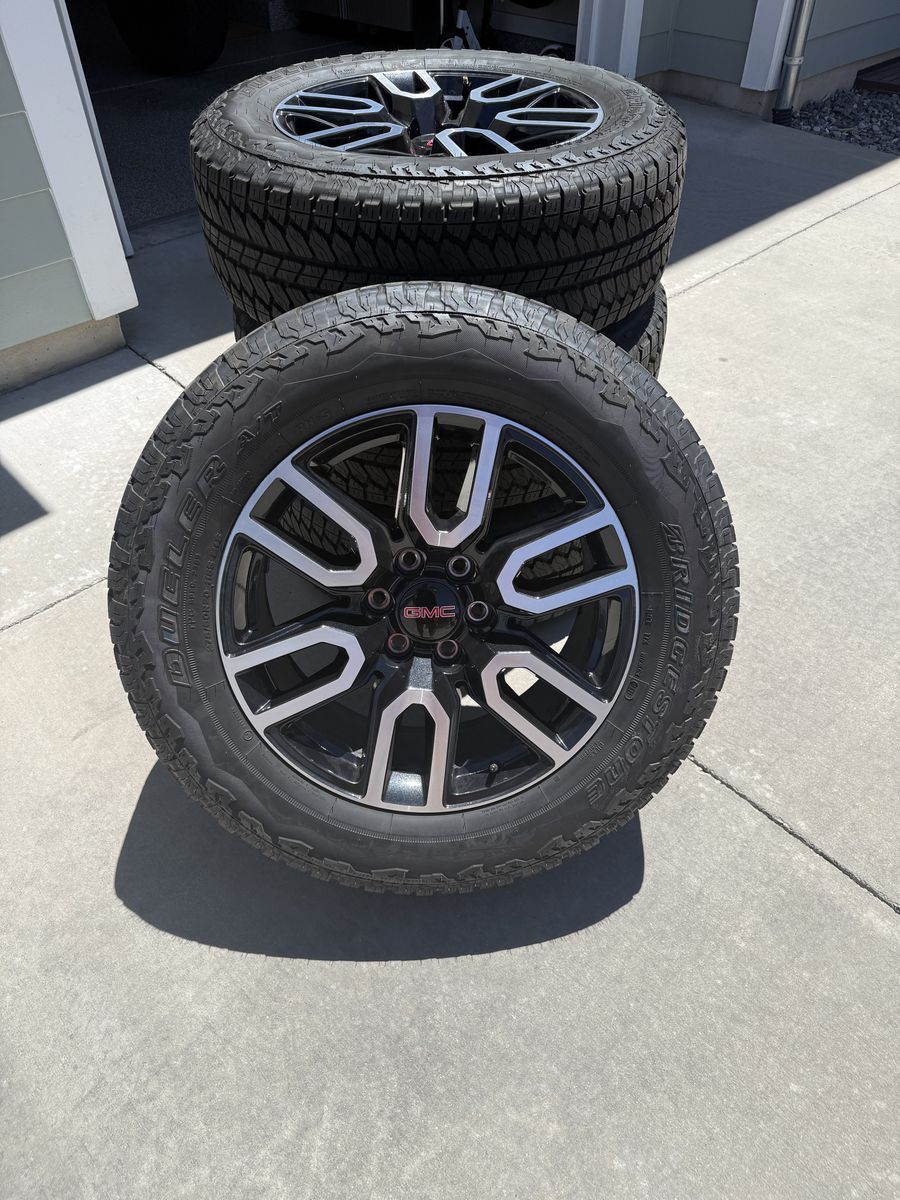 20 inch GMC factory wheels with Bridgestone Dueler tires