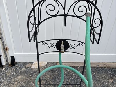 Freestanding hose holder