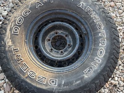 Armstrong Desert Dog A-T 31x10.50R15LT Tire on Black Steel Wheel