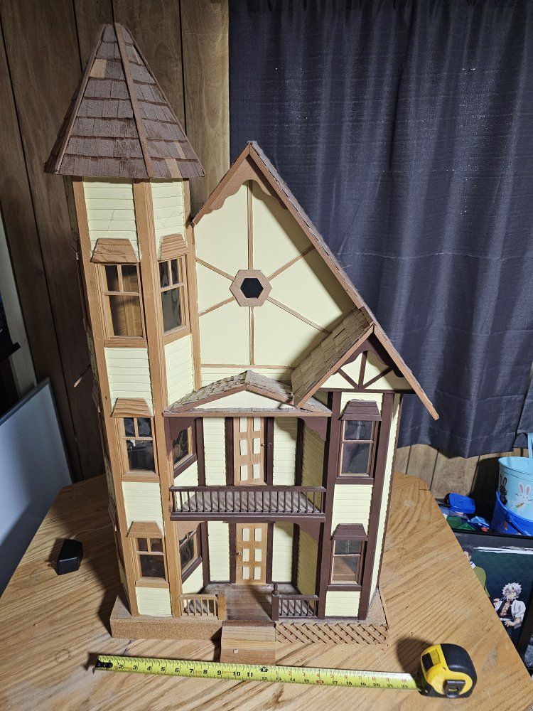 Large Wooden Victorian Dollhouse with Tower, amd furniture included.