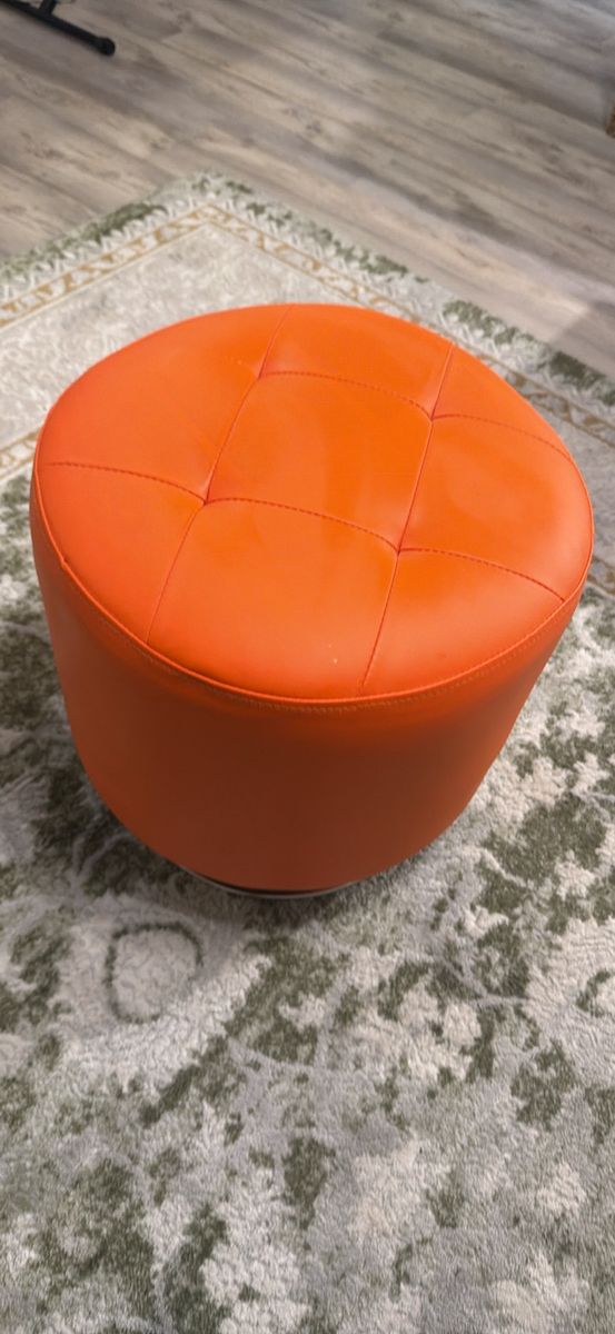 Modern swivel ottoman orange
