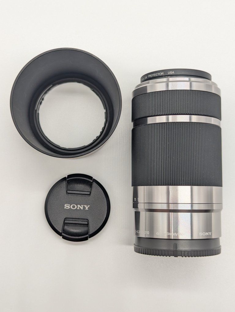 Sony E 55-210mm f/4.5-6.3 OSS E-Mount Lens SEL55210 Silver Excellent condition.