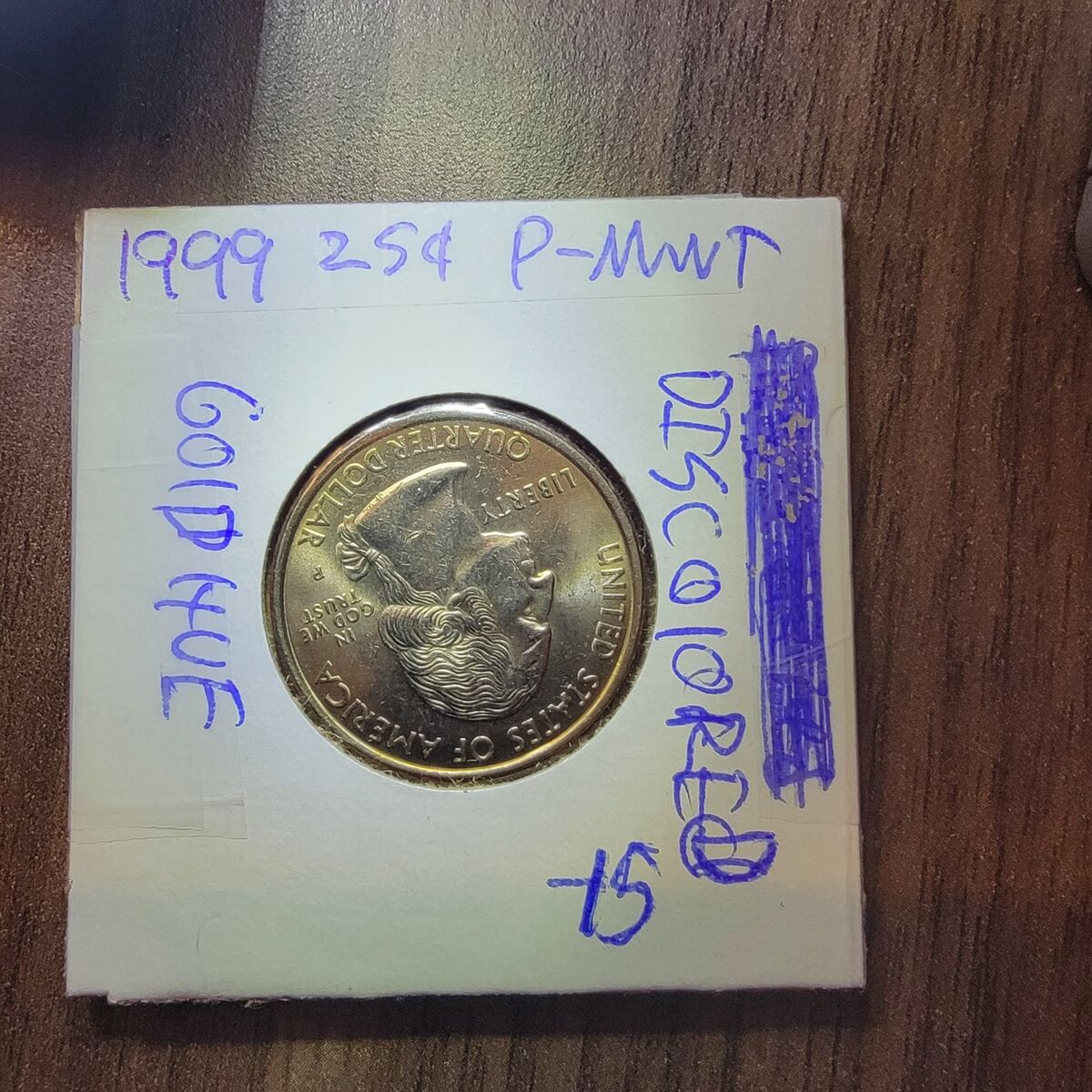 1999 quarter., with a gold hue.