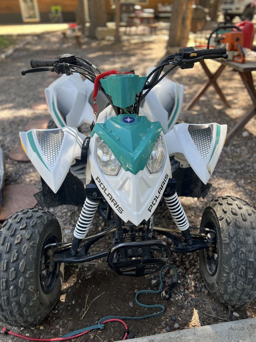 Polaris Outlaw 110 Kids ATV - White/Teal, Great Condition, Ready for Adventure