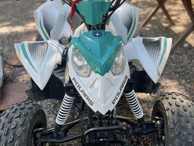Polaris Outlaw 110 Kids ATV - White/Teal, Great Condition, Ready for Adventure