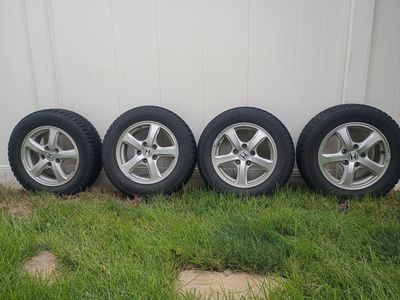 Four snow tires with rims nearly new condition