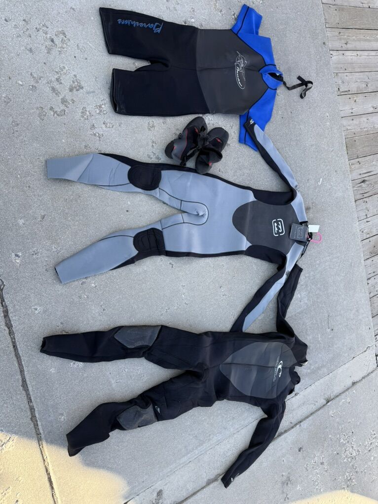 Three Medium/long wetsuits And Booties