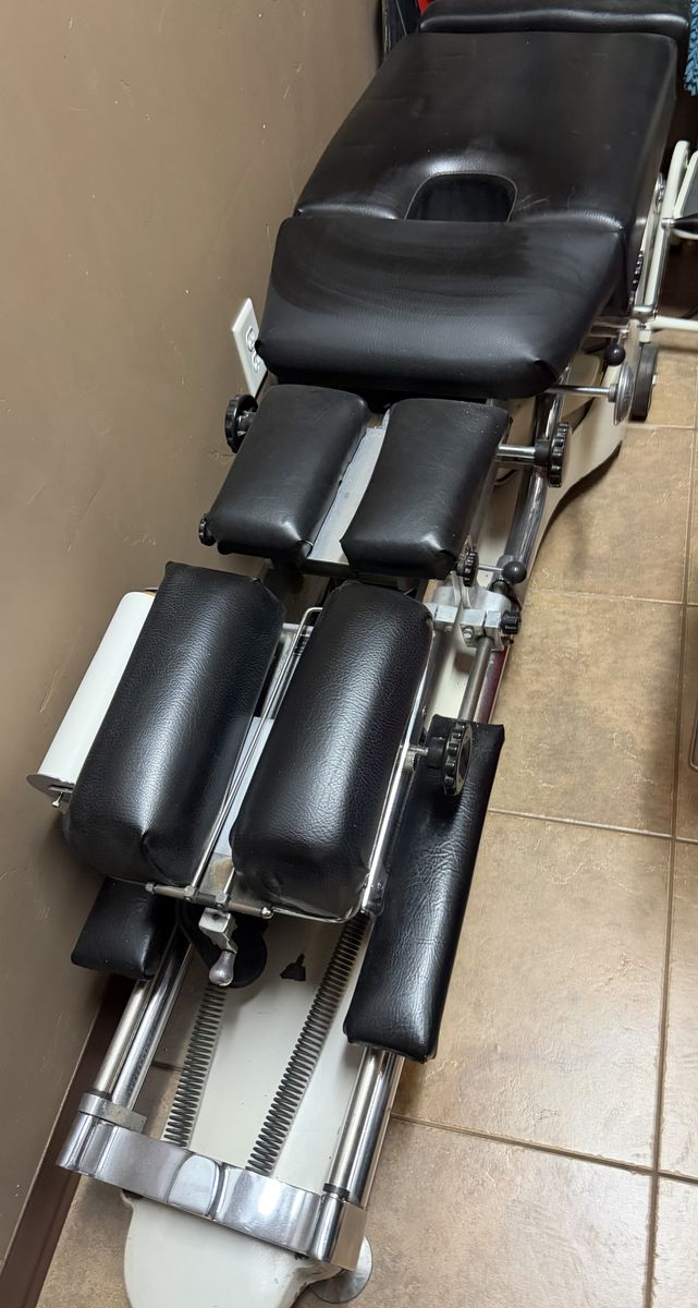 Used Black Chiropractic Adjustment Table with Adjustable Cushions