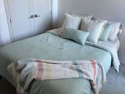 Queen bed frame, mattress, + all bedding/pillows