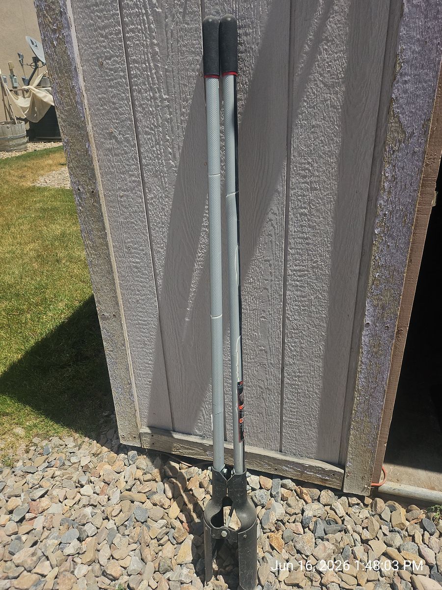 True Temper post hole digger with fiberglass handles and Triangular blades