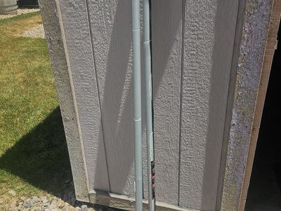 True Temper post hole digger with fiberglass handles and Triangular blades