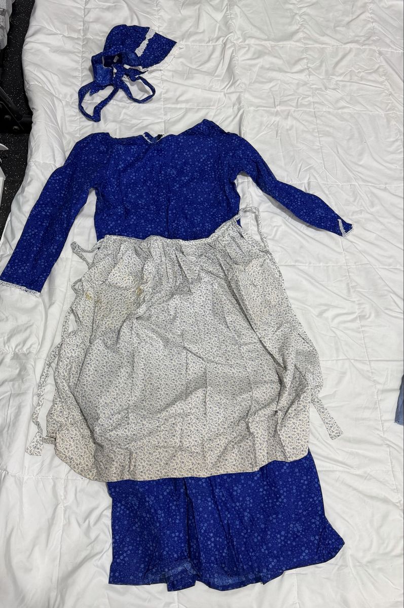 Beautiful blue pioneer with matching bonnet and color coordinated apron.