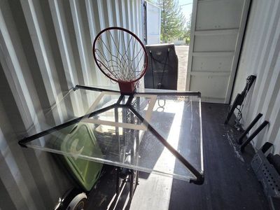 Silver back adjustable basketball hoop.